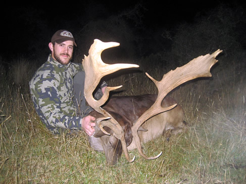Tyler Shanks with a SCI gold medal wild fallow buck